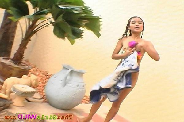 16P Tiny Thai babe Panni swimming nude outside at the pool
