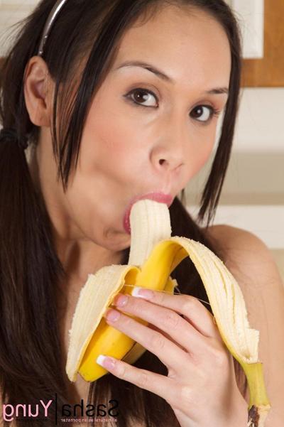 15P Hot asian babe Sasha Yung peels and blows a banana