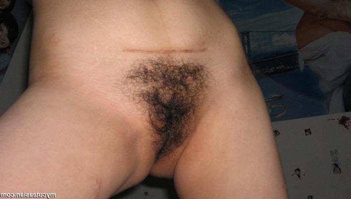 15P Naked Asian amateur shows her hairy pussy