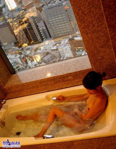 16P Hot Japanese tramp is naked on her bed showing off her body