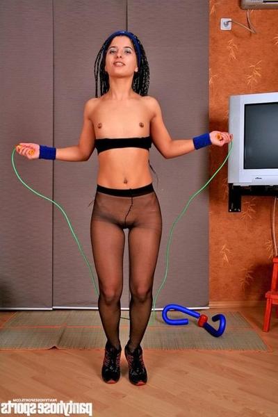 15P Stunning brunette exercises in black pantyhose