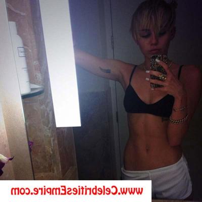 20P Miley Cyrus poses topless and nude in fishnet pantyhose