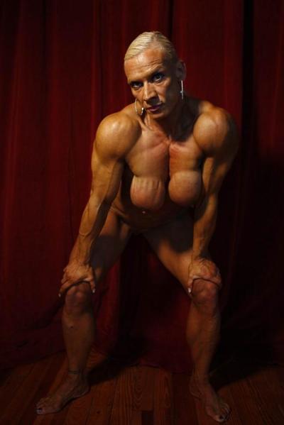 15P female bodybuilder showing off her muscles