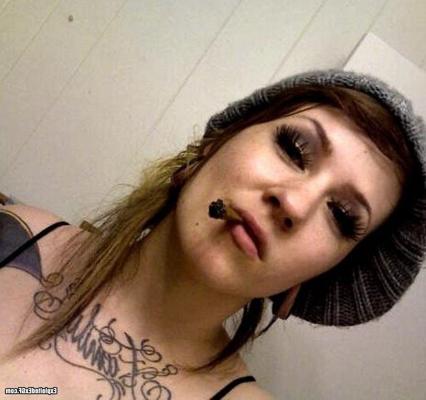15P Amateur girl with lots of tattos posing