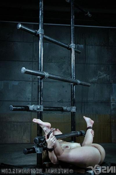 15P Devilynne is bound in metal pipes and toyed to bdsm orgasm