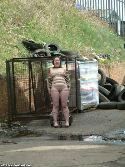 15P Slavegirl bound to a sacktruck