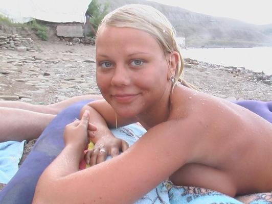 15P Sexy teen shocks the beach when she strips nude