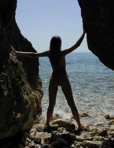 15P Long haired teen hottie lays around nude at the beach