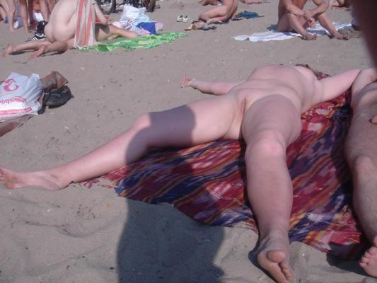 15P Gorgeous blonde young nudist plays in the water