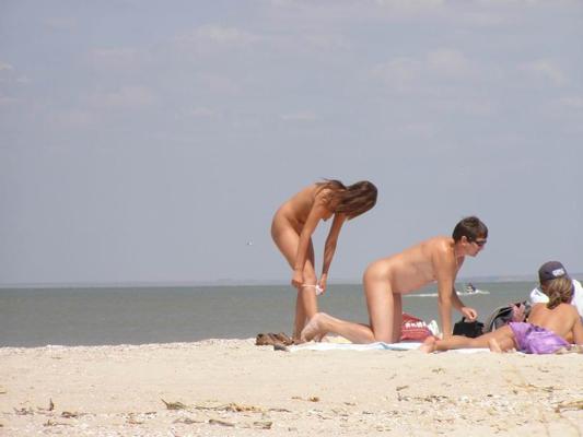 15P Barely legal nudist babe lights up at the beach