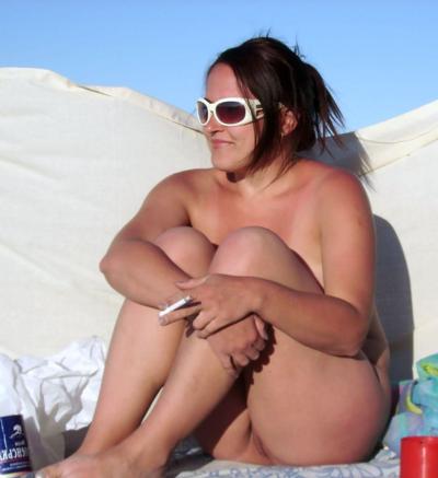 15P Sexy curvaceous cutie strips at a nudist beach
