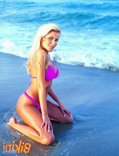 15P Hot blonde on the beach in a bikini