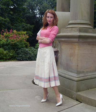 15P Cute redhead babe poses in a pair of lovely white high heeled stilettos for all 