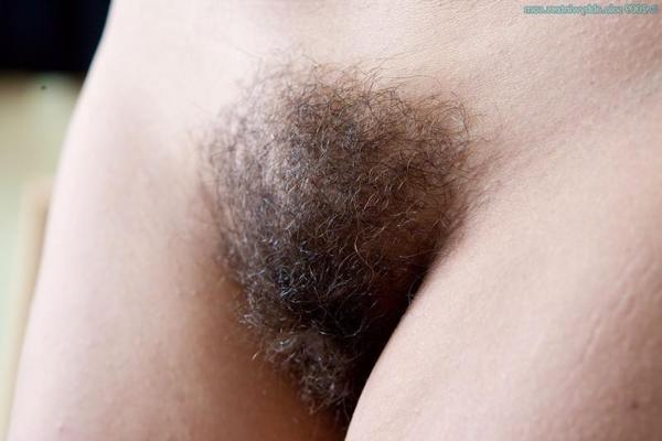 16P Busty amateur Edita strips and shows her hairy pussy