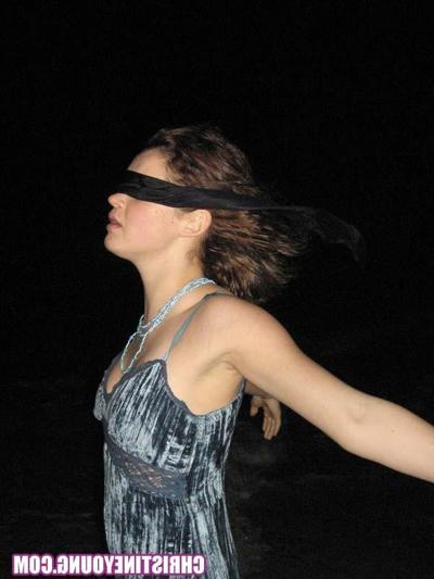 15P Cheerful teen Christine Young poses after dark on the beach