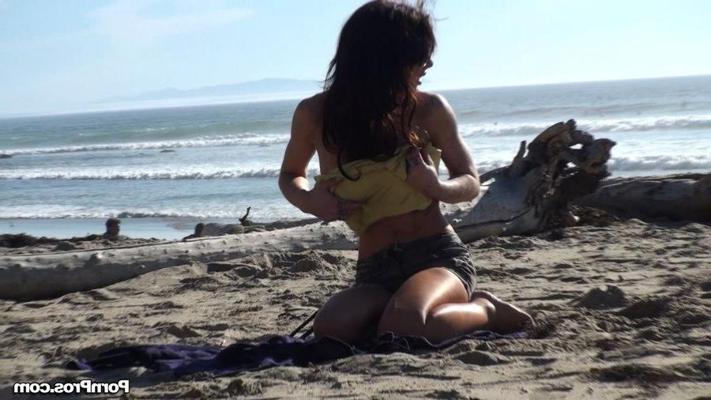 12P Busty beach beauty gets her bikini top stolen