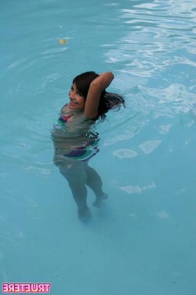 16P Bikini teen girl swimming in pool