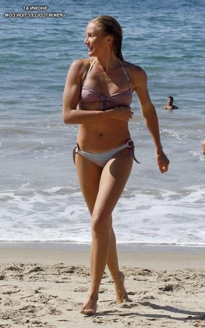 15P Female in white bikini relaxing in the water