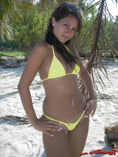 16P Latina teen wearing yellow bikini on beach