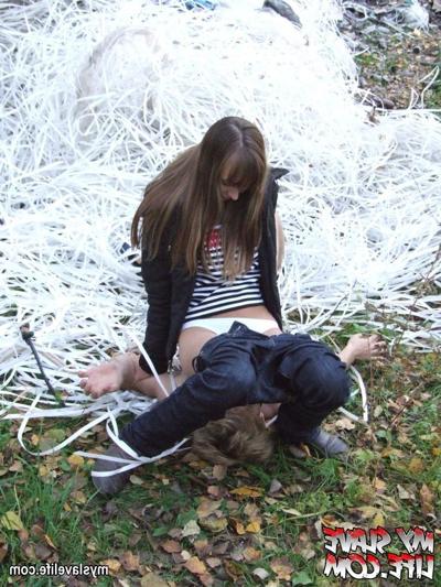 9P Lady bounds guy near the tree and uses him as ashtray