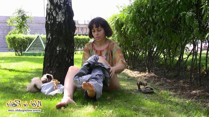 16P Desperate lady relieves herself on the move wetting her jeans in a park