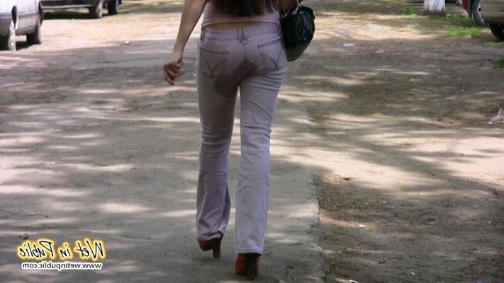 10P Longhaired amateur desperate to pee wets her pants and the asphalt