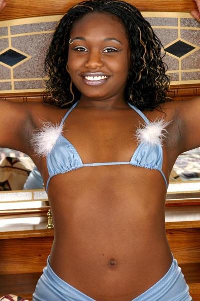 20P Gorgeous ebony babe spreading her tight shaved twat