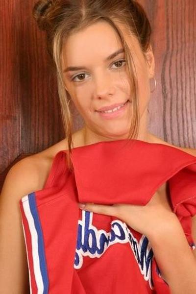 20P Beautiful teen cheerleader strip teasing and spreading twat