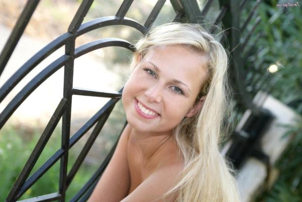 15P Sensual blonde cutie showing off her sweet body in the backyard