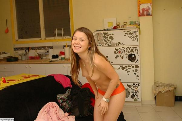 16P Pretty brunette teen girl removes bathrobe