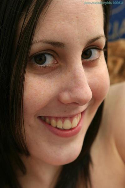16P Amateur brunette girl strips and shows off her shaved pussy