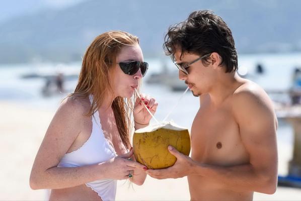 16P Lindsay Lohan busty showing pokies in white swimsuit