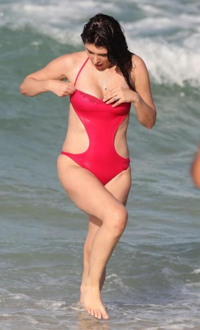 16P Brittny Gastineau nipple slip in red swimsuit at the beach