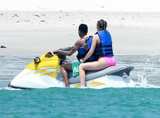 16P Kylie Jenner shows off her curvy body in a pink swimsuit