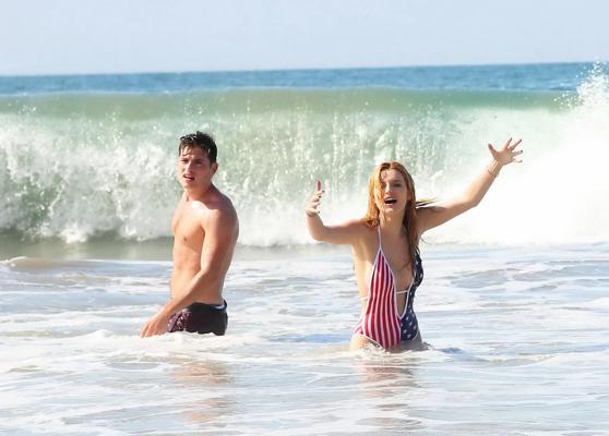 16P Bella Thorne in low cut national colored swimsuit