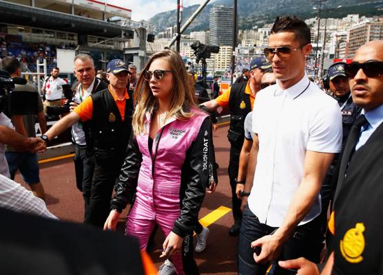 16P Cara Delevingne bra peak wearing an auto racing suit at McLaren Honda pitlane ph