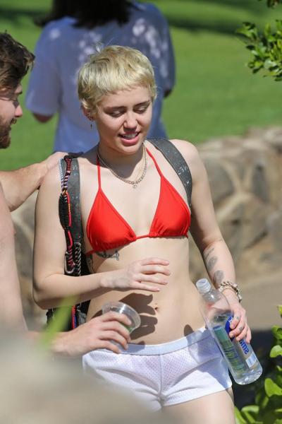 16P Miley Cyrus wearing tiny red bikini and seethrough shorts at a vacation in Hawai