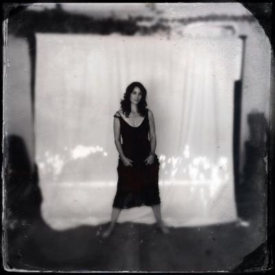 16P Busty CarrieAnne Moss wearing a low cut black dress in Catherine Just Photoshoot