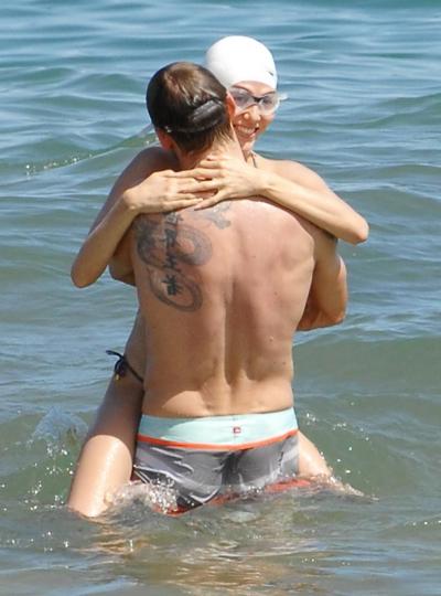 15P Jessica Michibata shows off her juicy ass in a tiny floral bikini at the beach i