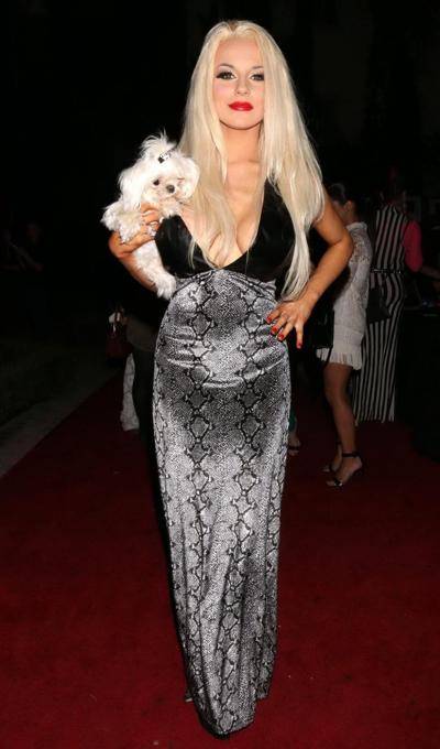 16P Courtney Stodden nipple slip in a low cut snake print dress at the Art Loves Fas