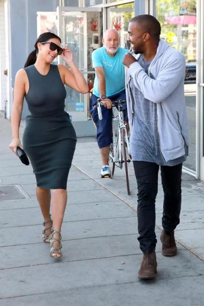 10P Kim Kardashian shows off her booty and big boobs in see through top while out sh