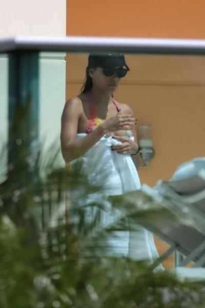 12P Eva Longoria caught in a tiny colorful bikini poolside in Miami