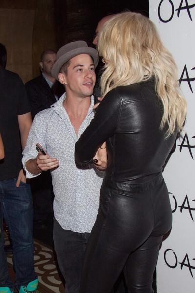 14P Rita Ora shows off her ass and cleavage wearing a black leather jumpsuit at Tao 