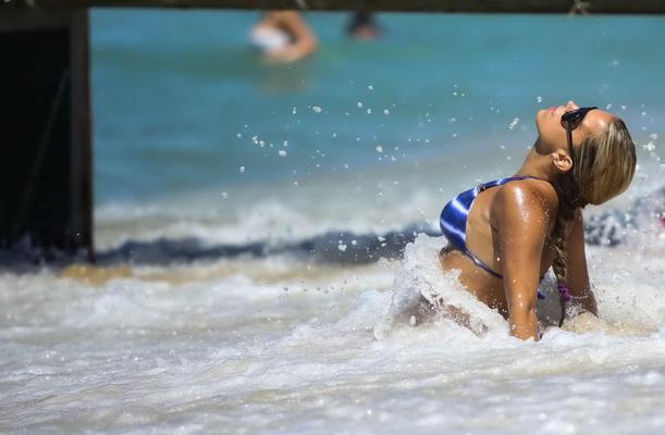 16P Sylvie van der Vaart showing off her toned body in a skimpy blue bikini on the b