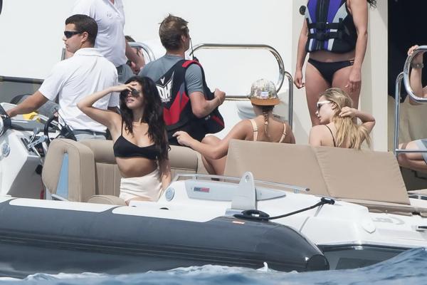 16P Selena Gomez and Cara Delevingne wearing skimpy black bikinis at a yacht in Sain