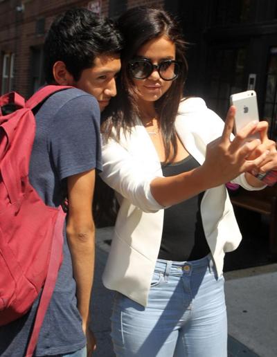 16P Selena Gomez shows pokies braless and all sweaty in slightly transparent black t