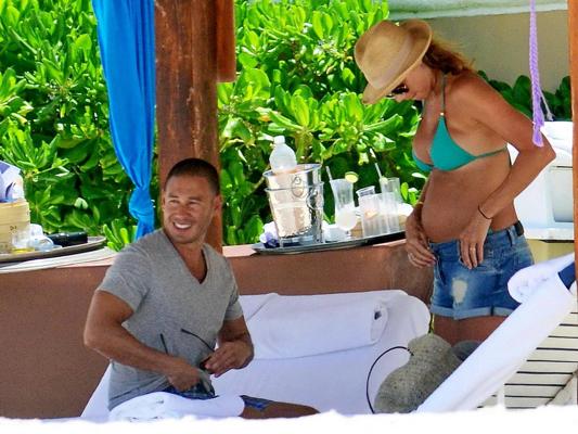 16P Stacy Keibler pregnant wearing a turquoise bikini in Mexico