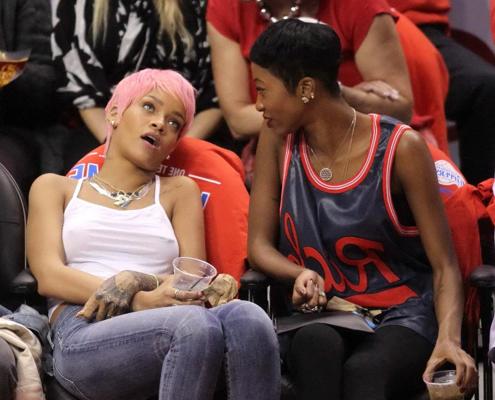 16P Rihanna braless wearing a white top at the Clippers game in LA