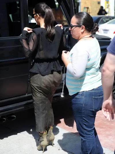 16P Kim Kardashian shows cleavage and booty while shopping at Canyon Beachwear