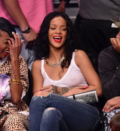 16P Rihanna shows off her boobs in seethru top at a basketball game in NYC